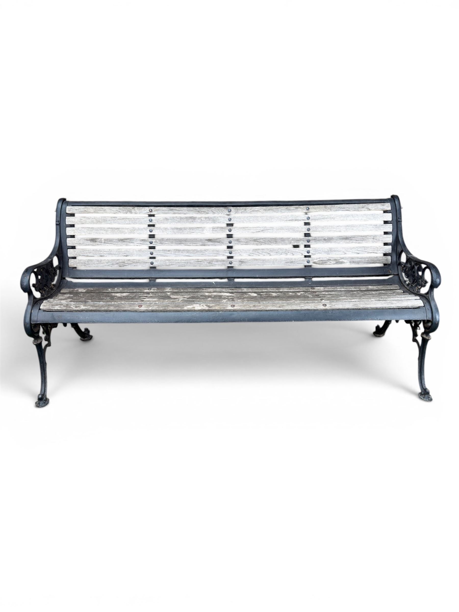 Victorian Andrew McLaren pattern cast iron bench, the ornate ends with detailed scrollwork, joined together with a cast iron seat and backrest frame supporting gently weathered oak slats, Victorian diamond stamp mark
