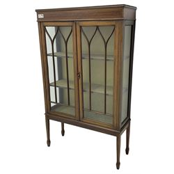 Edwardian inlaid mahogany display cabinet, lined interior fitted with two shelves enclosed by astragal glazed doors, on square tapering supports with spade feet