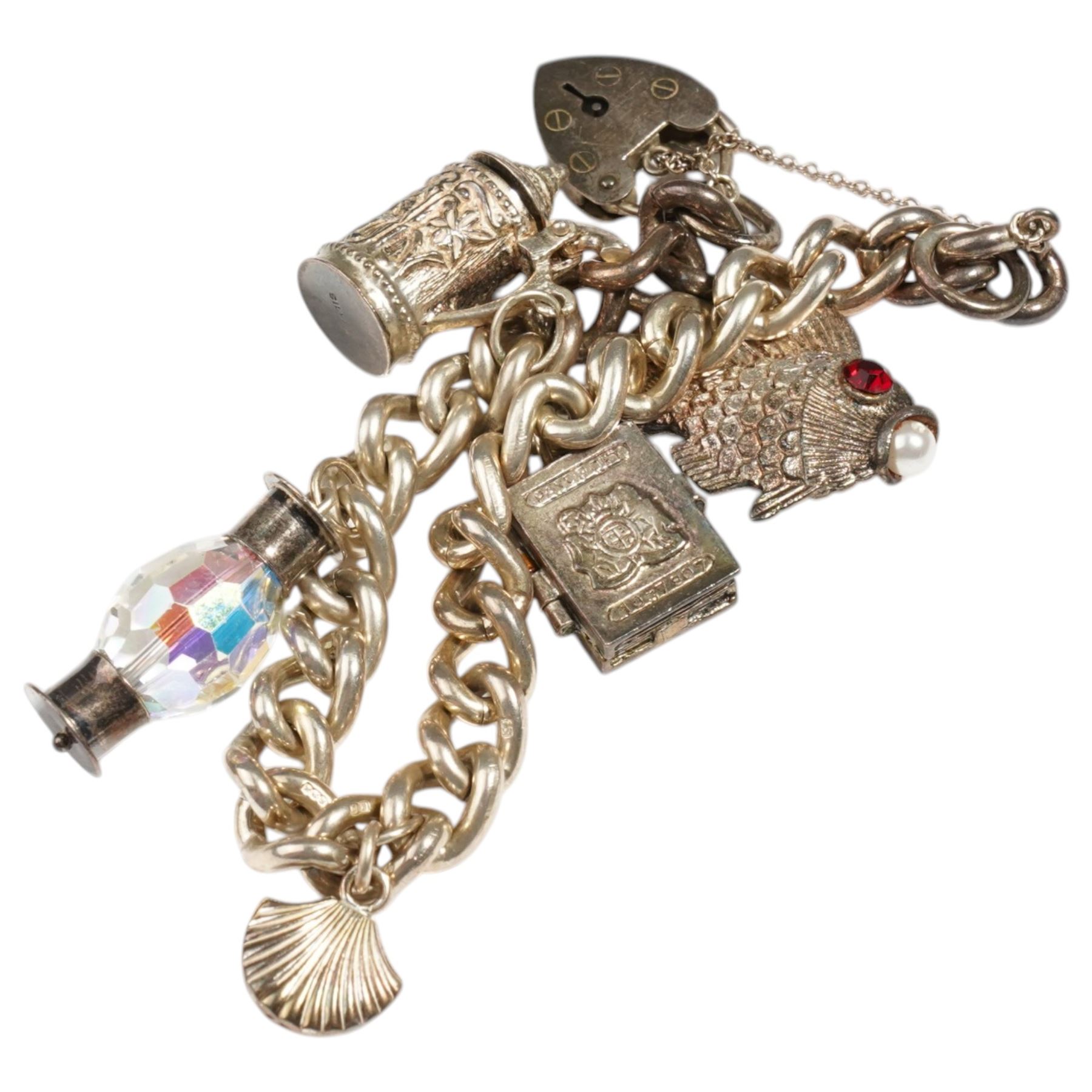 Silver charm bracelet including fish, shell and tankard and two additional silver charms