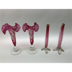 Group of Victorian and later cranberry glass, to include pair of Mary Gregory style vases, and similar beaker 