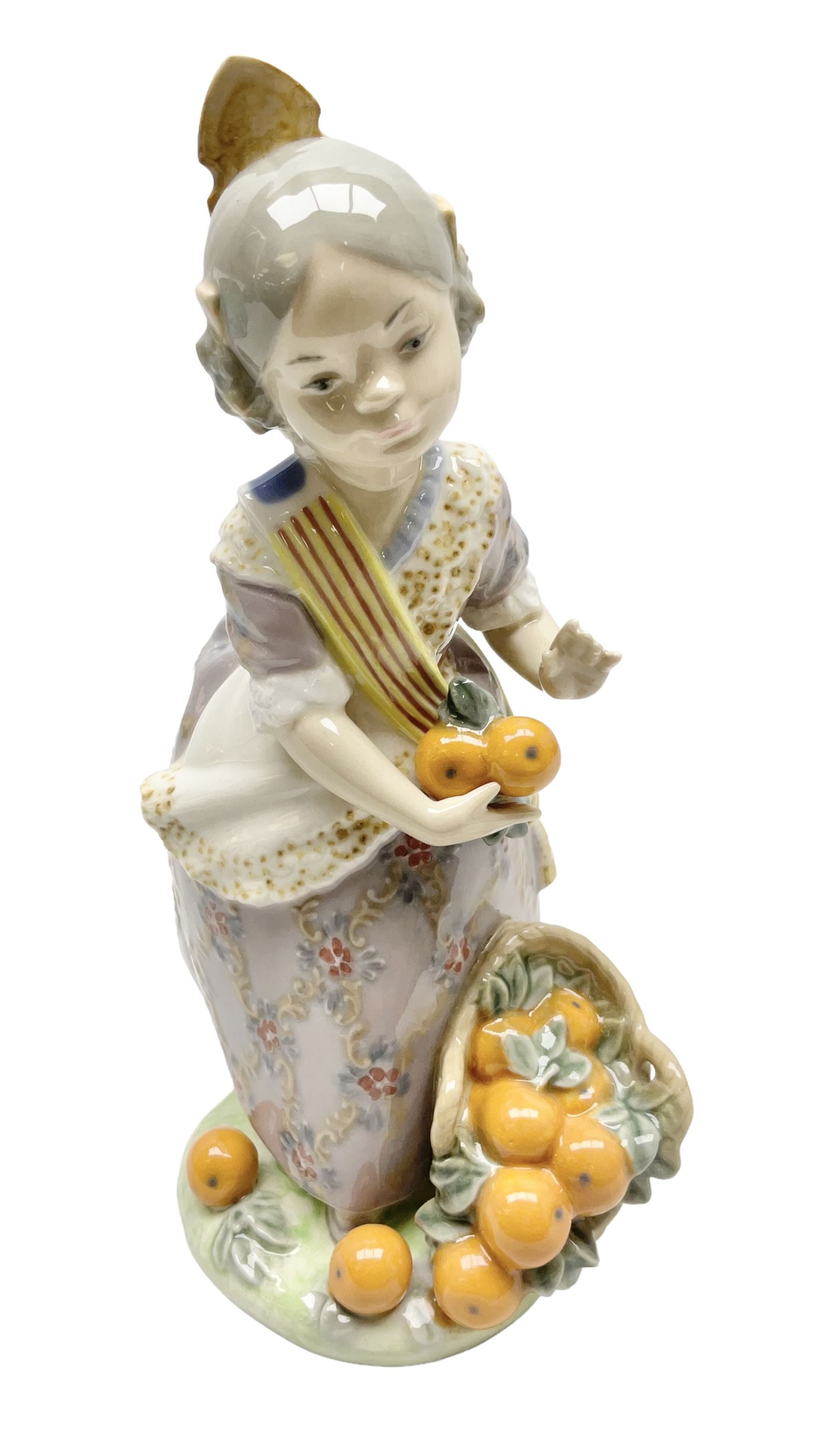 Lladro figure, Miss Valencia, modelled in traditional Valencian dress with basket of oranges, sculpted by Juan Huerta, with original box, no 1422, year issued 1982, year retired 1997, H18cm