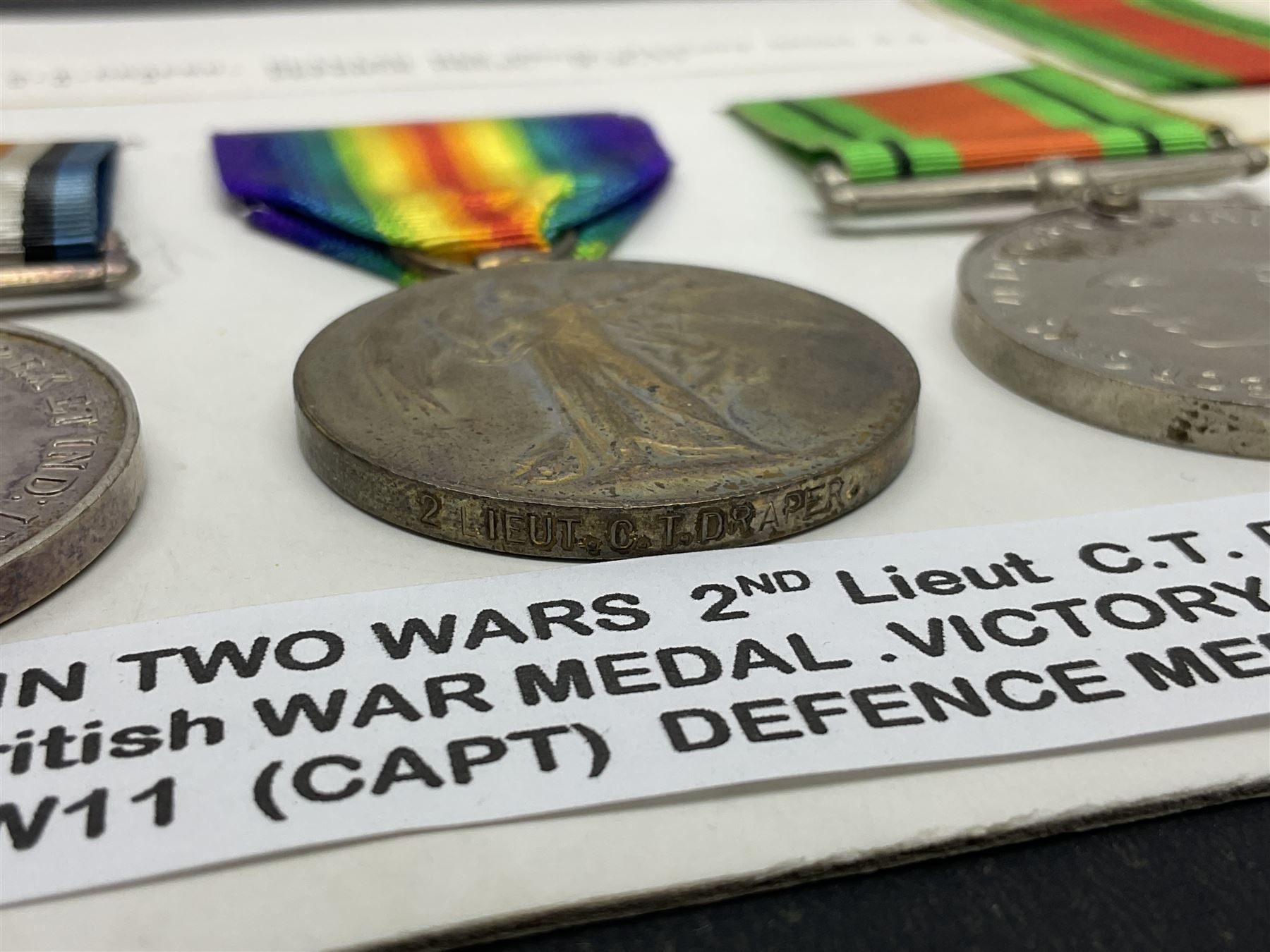 WWI pair of medals comprising British War Medal and Victory Medal awarded to 2nd Lieutenant C.T. Draper; and WWII Defence Medal awarded to Captain C.T. Draper with War Office letter of confirmation; all with ribbons (3)