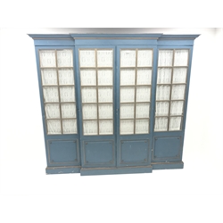  Large early 20th century breakfront four door wardrobe, projecting cornice, light royal blue and gilt painted finish, glazed doors enclosing fitted interior, plinth base, W228cm, H204cm, D61cm  
