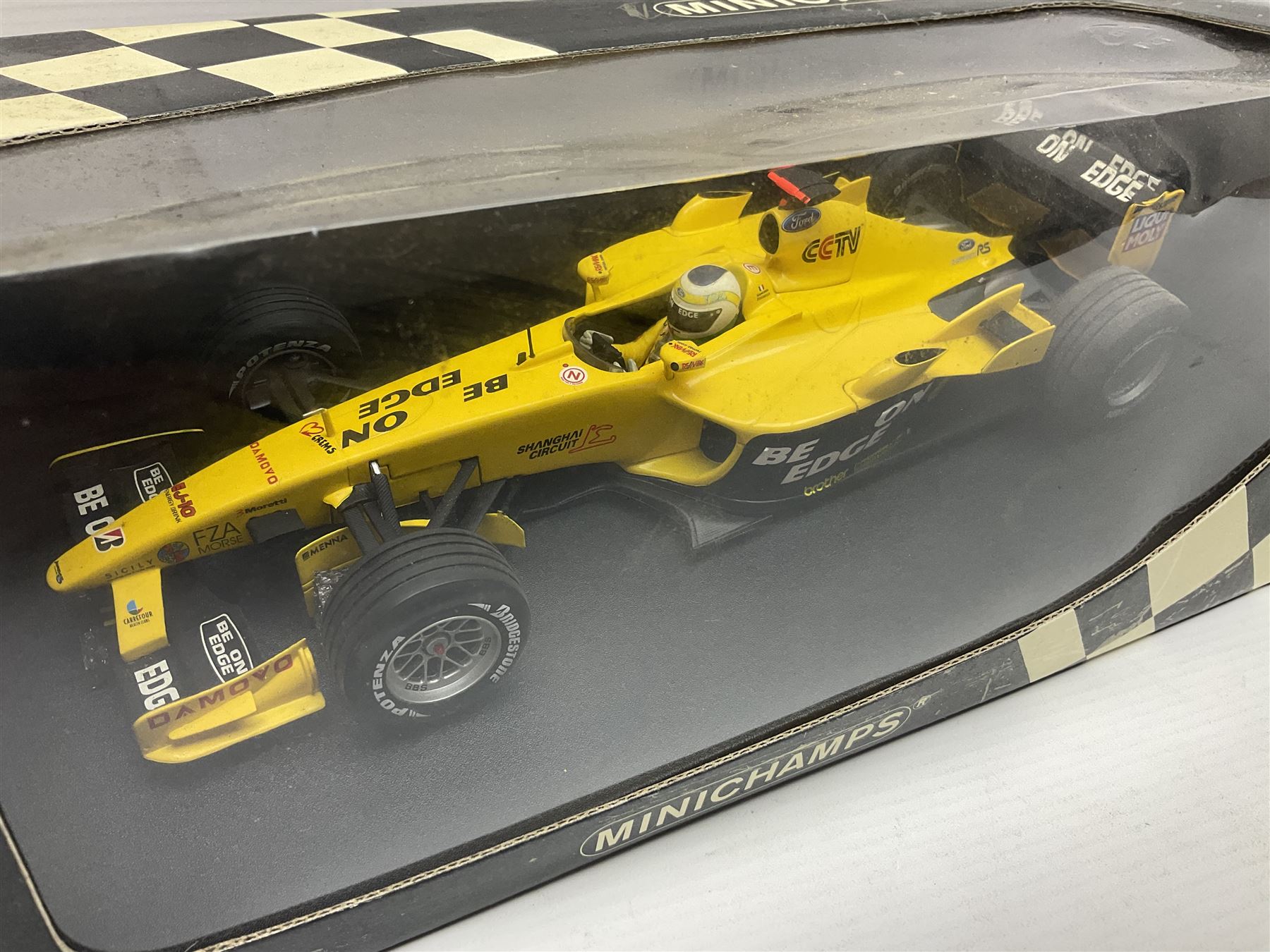 Three Minichamps 1:18 scale die-cast racing cars - Jordan Mugen Honda 198 D. Hill; Jordan Ford EJ13 G. Fisichella; and Stewart Ford SF 1 R. Barrichello; all boxed (3)