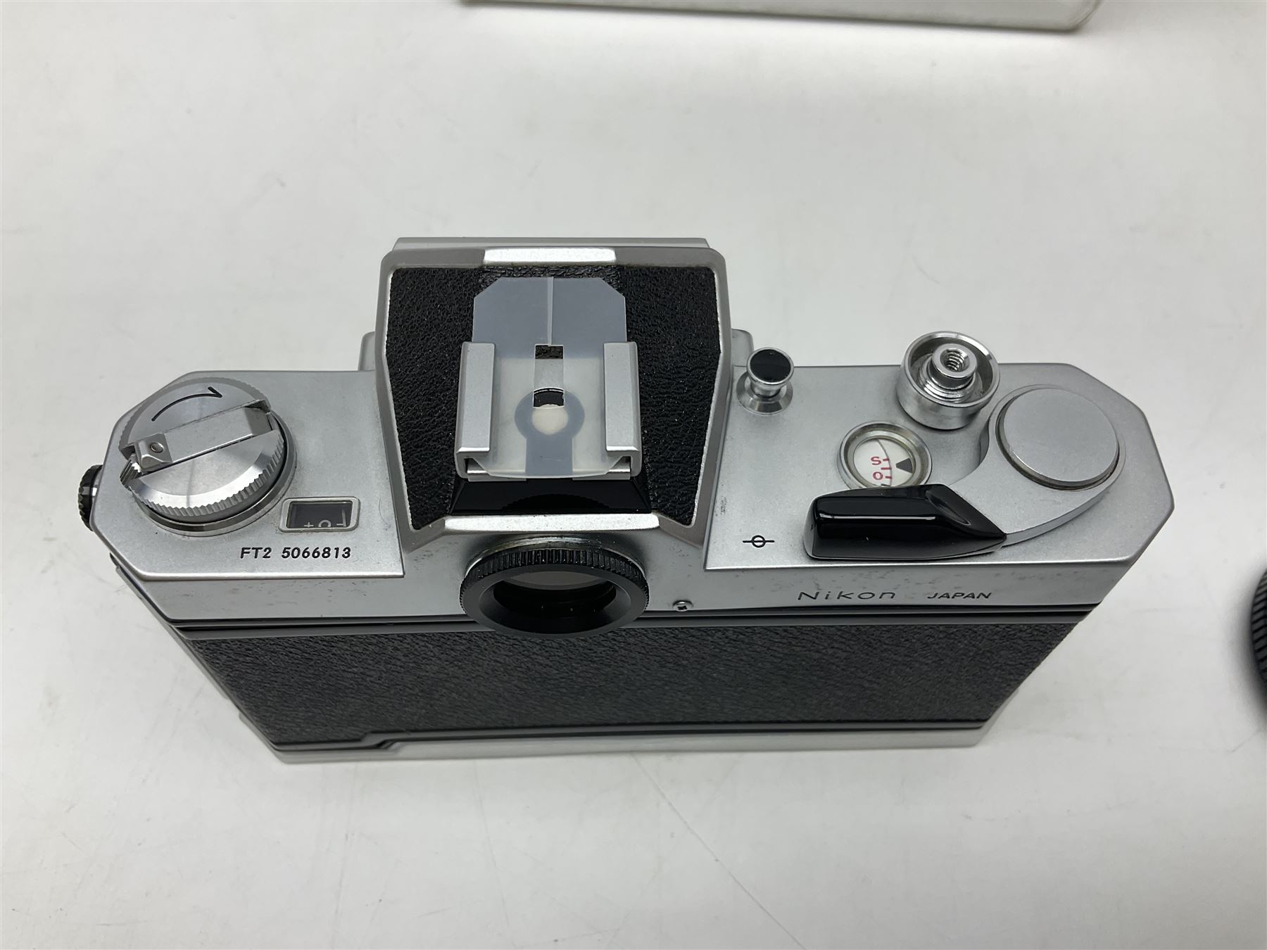 Nikkormat FT2 camera body, serial no. 5066813, in original packaging, together with Nikkormat EL camera body, serial no. 5577358, with Nikon Nikkor 50mm 1:1.8' lens no. 2143575, Nikkormat FT, serial no. 3968385, and Nikomat FT camera body, serial no. 4015491
