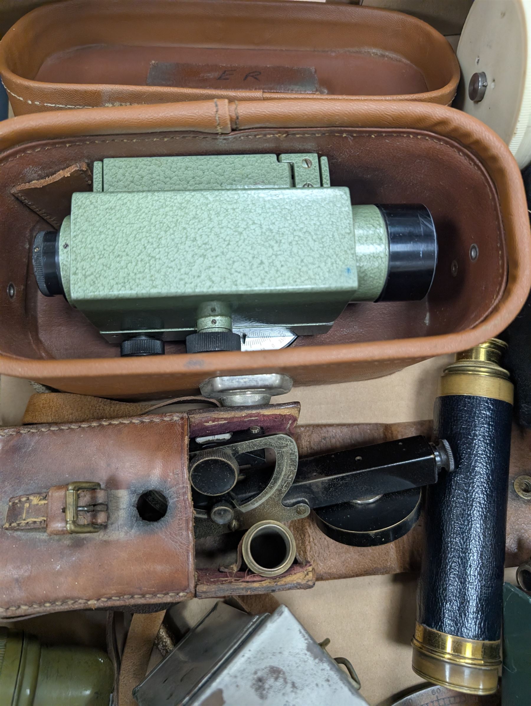 Two dumpy levels including Watts & Son ltd example and a Vickers Instruments example, US Navy bubble sextant, GT Price torch stamped US MX 991/U, 'The Unique' slide rule, three draw telescope and other instruments