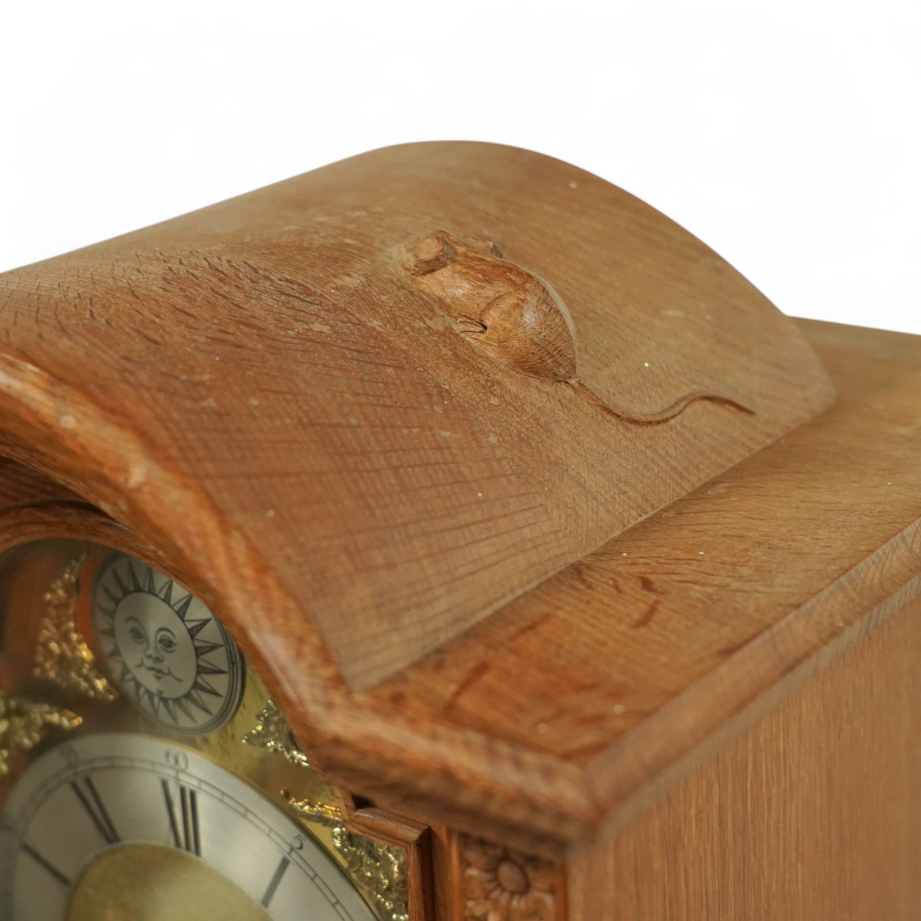 Mouseman - Oak 8-day grandmother clock, with a high quality weight driven movement and dial by Sinclair and Harding & Co of Cheltenham (No 477), brass break-arch dial with pierced steel hands, cast spandrels and a matted dial centre, silvered chapter with Roman numerals and minute track, dial pinned to  a two train rack striking movement, striking the hours on a cast bell, case with a full length glazed door and visible brass cased weights and conforming brass cased cylindrical pendulum. Signature carved mouse to the top of the arch of the case, from the workshop of Robert Thompson of Kilburn
With key.
Longcase.