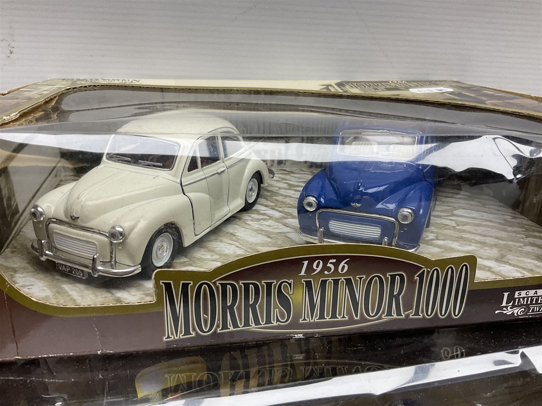 Two Bburago 1:18 scale die-cast models - Volkswagen New Beetle 1998 and Volkswagen Kafer-Beetle 1955; Corgi CC99109 Cooper 'S' three-piece set on dashboard stand; Saico 1956 Morris Minor 1000 limited edition twin-pack; and Corgi limited edition 59564 Guinness Scania Tanker and Drop-side lorry set; all boxed (5)