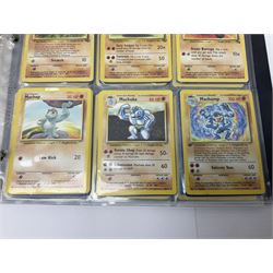 Collection of Pokemon trading cards, mostly 1999 Wizards Pokemon cards to include holo Charizard 4/102, first edition holo Machamp 8/102, further holographic cards; Dark Flareon 35/82 and Dark Vaporeon 45/82, cards from themed sets and 4th edition prints; 1998 Electronic Pokédex with cardboard boxes for themed decks Blackout, Overgrowth and Power Reserve Jungle, along with a large quantity of energy and trainer cards 