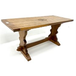 Yorkshire oak rectangular coffee table, shaped end supports on sledge feet joined by stretcher, carved rose (W91cm, H44cm, D40cm) and two three legged stools (H31cm)