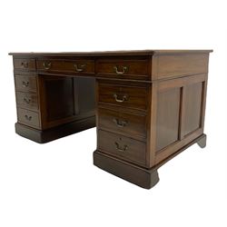 Edwardian mahogany twin pedestal desk, fitted with nine drawers, inset leather writing surface, panelled sides