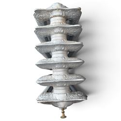 French ornate cast iron column radiator of Rococo Revival design, each section cast with scrolling foliate decoration with rocaille and cartouche motifs, with brass valve and integral bracket feet, in painted silvered finish