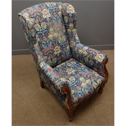  Victorian wingback armchair, upholstered in floral pattern fabric, scrolled arms and turned supports  