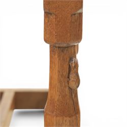 Mouseman - oak panel back carver armchair, with commemorative back panel engraved 'In memory of Fiona Mary Fotheringham Born 5th June 1958 Died 14th July 1965', above tan seat with brass studded trim, with carved Mouse signature, by Robert Thompson's of Kilburn