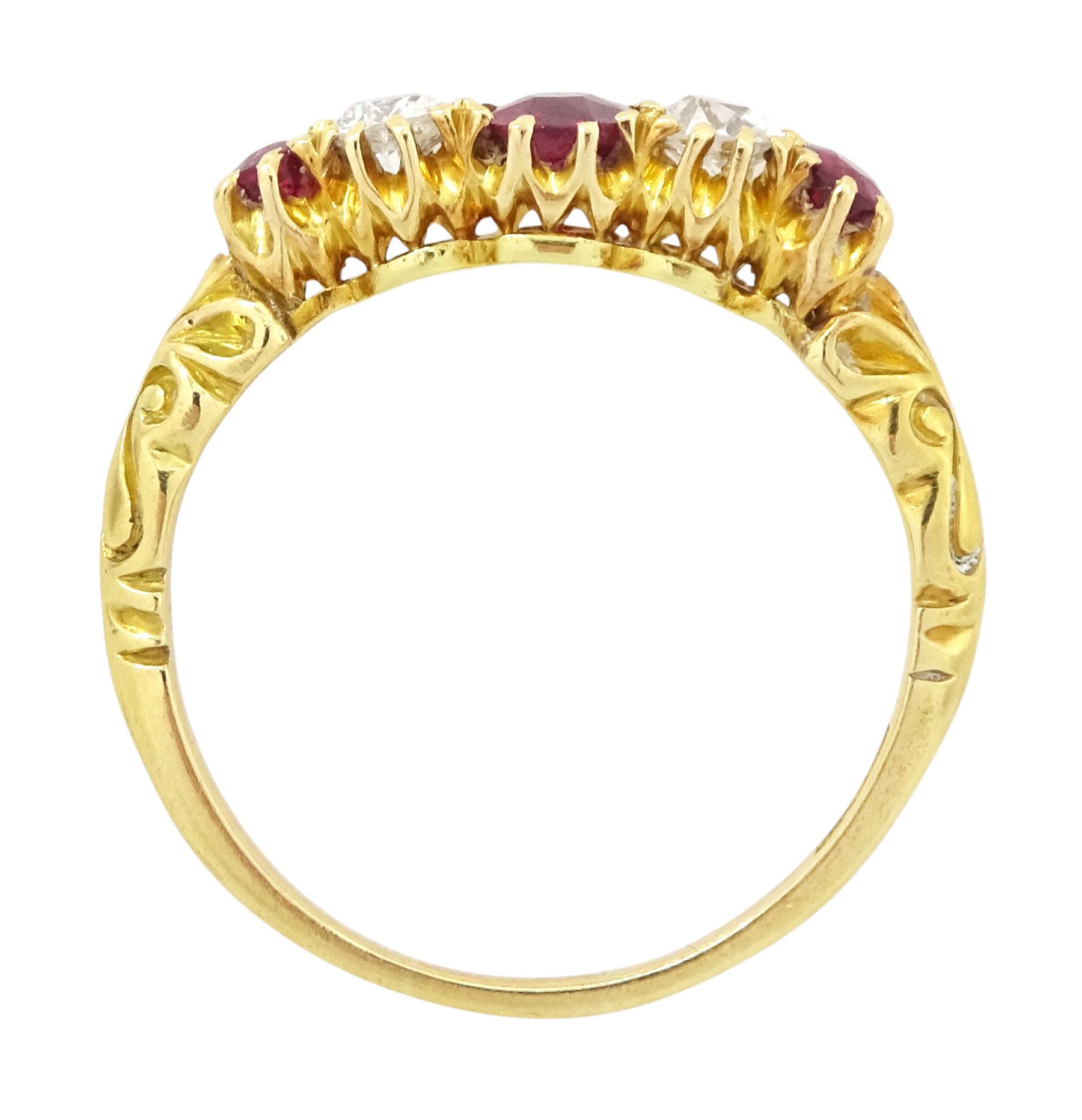 Early 20th century 18ct gold ruby and diamond five stone ring, three oval and round cut rubies, spaced by two old cut diamonds, stamped 18, total ruby weight approx 0.55 carat, total diamond weight approx 0.30 carat