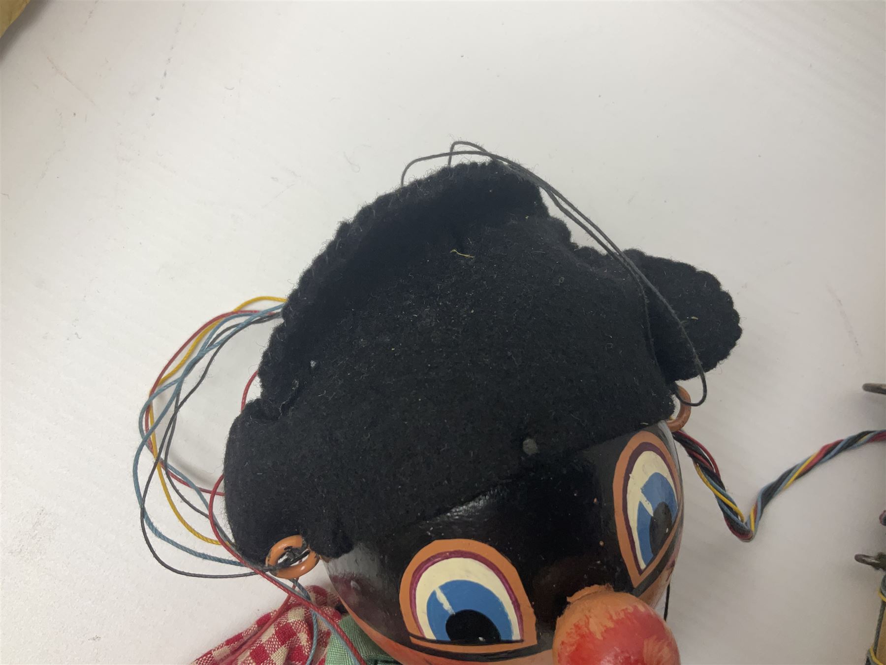 Pelham Puppet - a rare type SM Harlequin circa 1950s with painted black face mask, black felt hat, green ruff and red white chequered suit, H31cm; in original box with instructions 