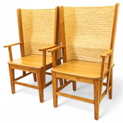 Pair of 20th century full-size pine Orkney chairs, high-back armchairs of traditional design, pegged and wedged construction, wrap-around backrest and sides, above scrolled out-swept arms and solid rounded pine seat, raised on square tapering legs united by stretchers, hand-signed ‘Jackie Miller’ and stamped ‘Orkney’
