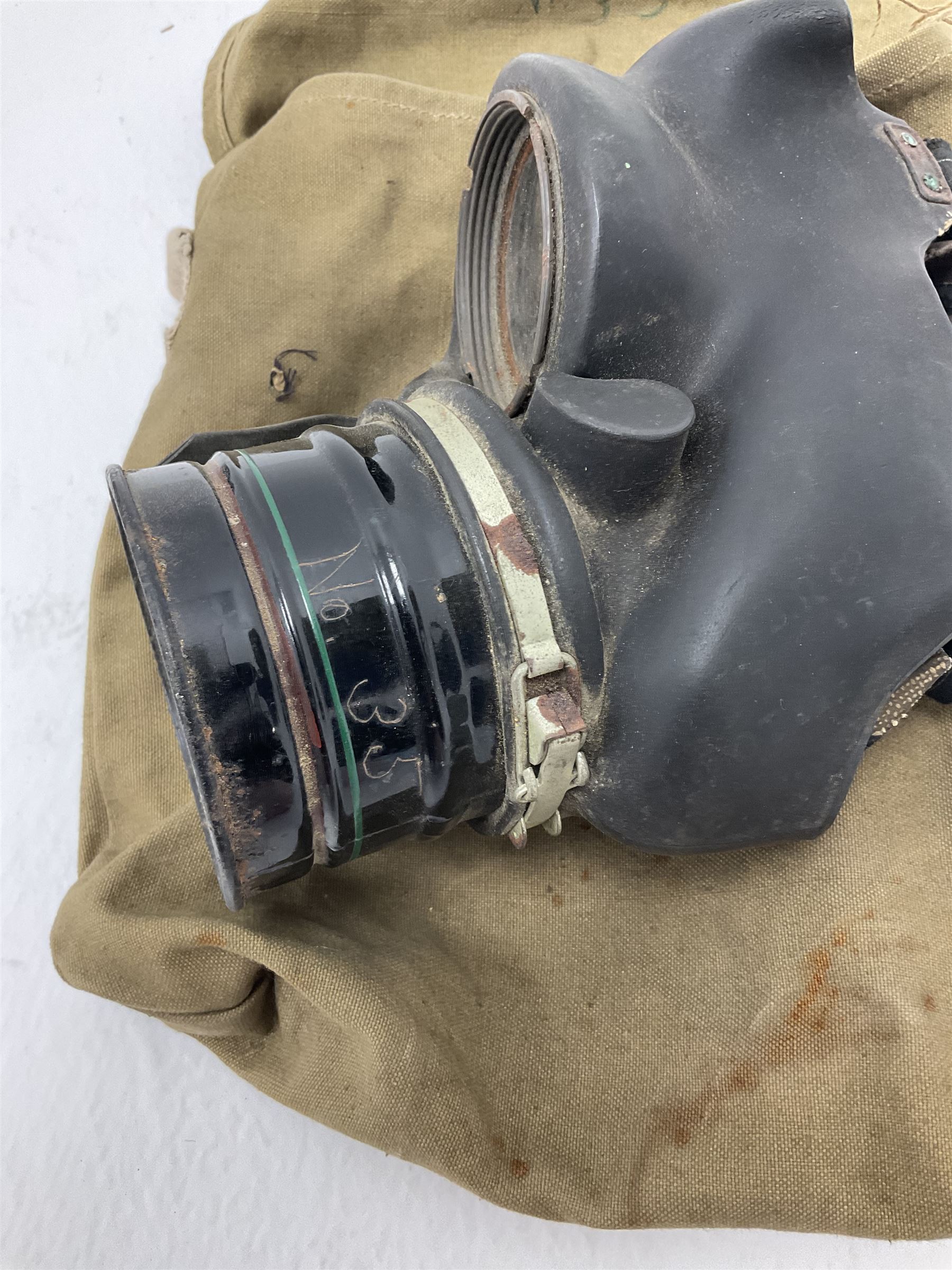 RAF Flight Lieutenant's uniform with peaked cap and WW2 ribbon bar; WW2 gas mask in blue canvas bag dated 1942; flying helmet date 1984; and British Army Major's uniform with Staybrite buttons and peaked cap