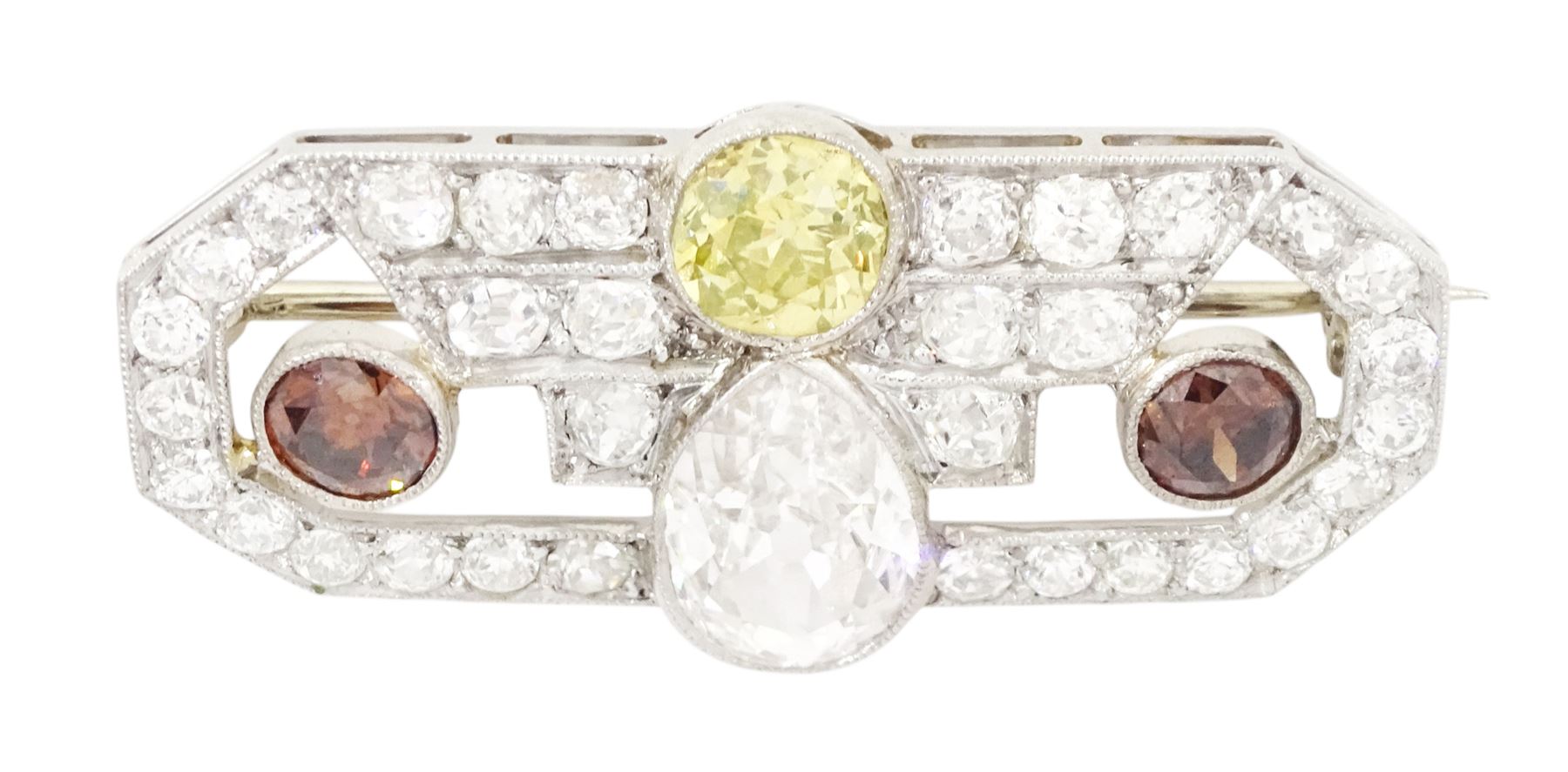 Early 20th century platinum diamond brooch, milgrain set with a pear cut faint brown diamond of approx 1.50 carat, an old cut fancy yellow / green diamond of approx 0.70 carat, and two old cut fancy orange / brown diamonds of approx 0.40 carat and 0.35 carat, surrounded by old cut white diamonds in an openwork setting, total white diamond weight approx 1.45 carat