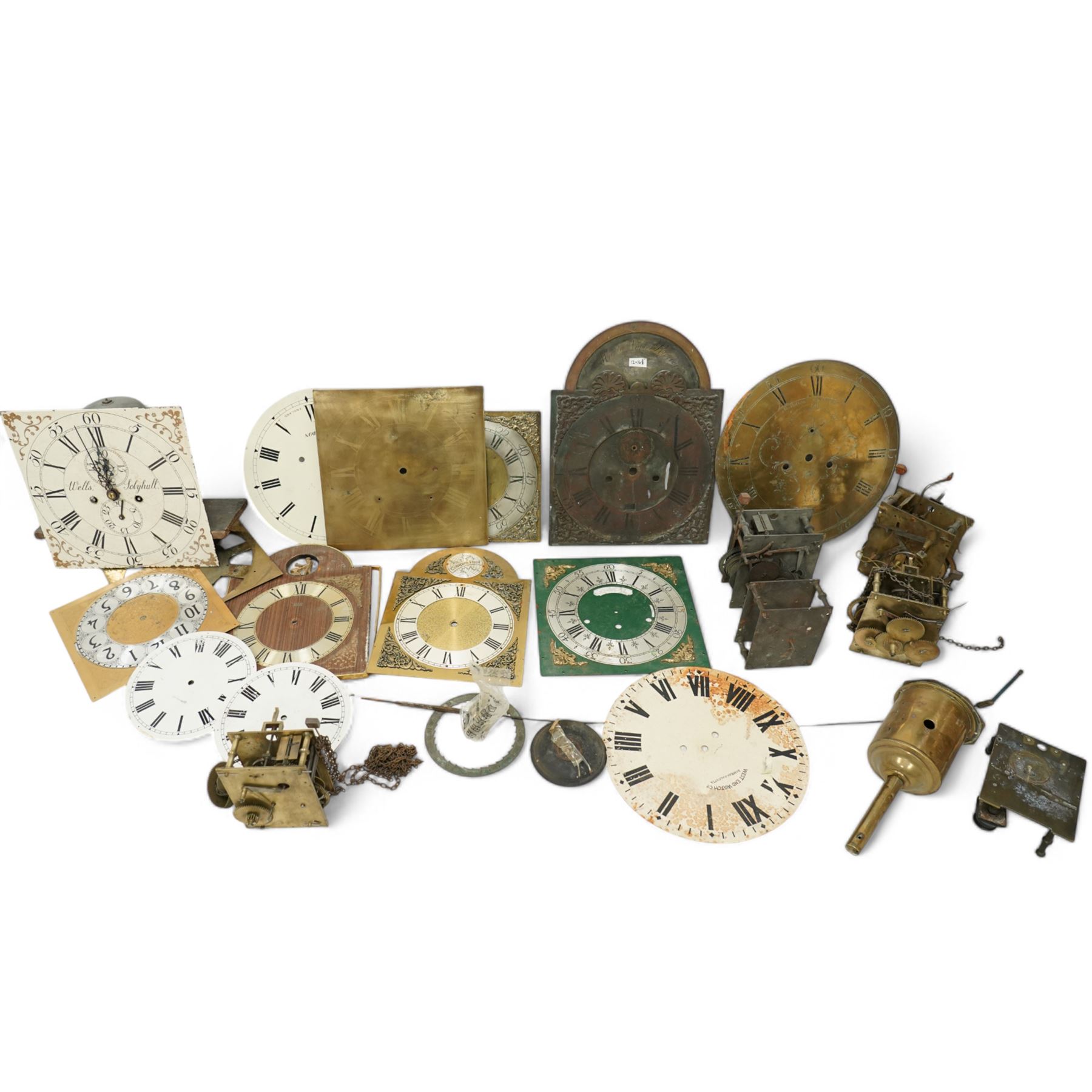 An 8-day longcase clock movement with a painted dial and various 8-day and 30-hour long case movements, dials, parts, plates, chains, and two lead weights, sold as incomplete for parts and restoration projects. 