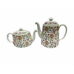 Minton Haddon Hall pattern tea and dinner wares, including basket dish, two covered tureens, six dinner plates, eight dessert plates, twelve tea plates, six soup bowls, six cereal bowls, teapot, coffee pot, milk jug, covered sucrier twelve tea cups and saucers, six mugs, footed bon bon dish, pair of candlestick holders, cake knife and slice etc (81)