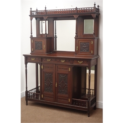  Edwardian walnut side cabinet, the mirrored back with open balustrade over three beveled glass panels and two carved cupboard doors, base with three frieze drawers, over a pair of carved cupboard doors flanked by open mirror back display shelves, W127cm, H179cm, D43cm  