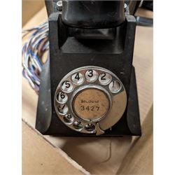 Two black telephones with Bakelite handles 