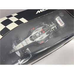 Three Minichamps 1:18 scale die-cast McLaren racing cars - Mercedes MP4-19 D. Coulthard; Mercedes MP4-20 K. Raikkonen; and Vodaphone Mercedes MP4-22 L. Hamilton 2007; all boxed (3)

