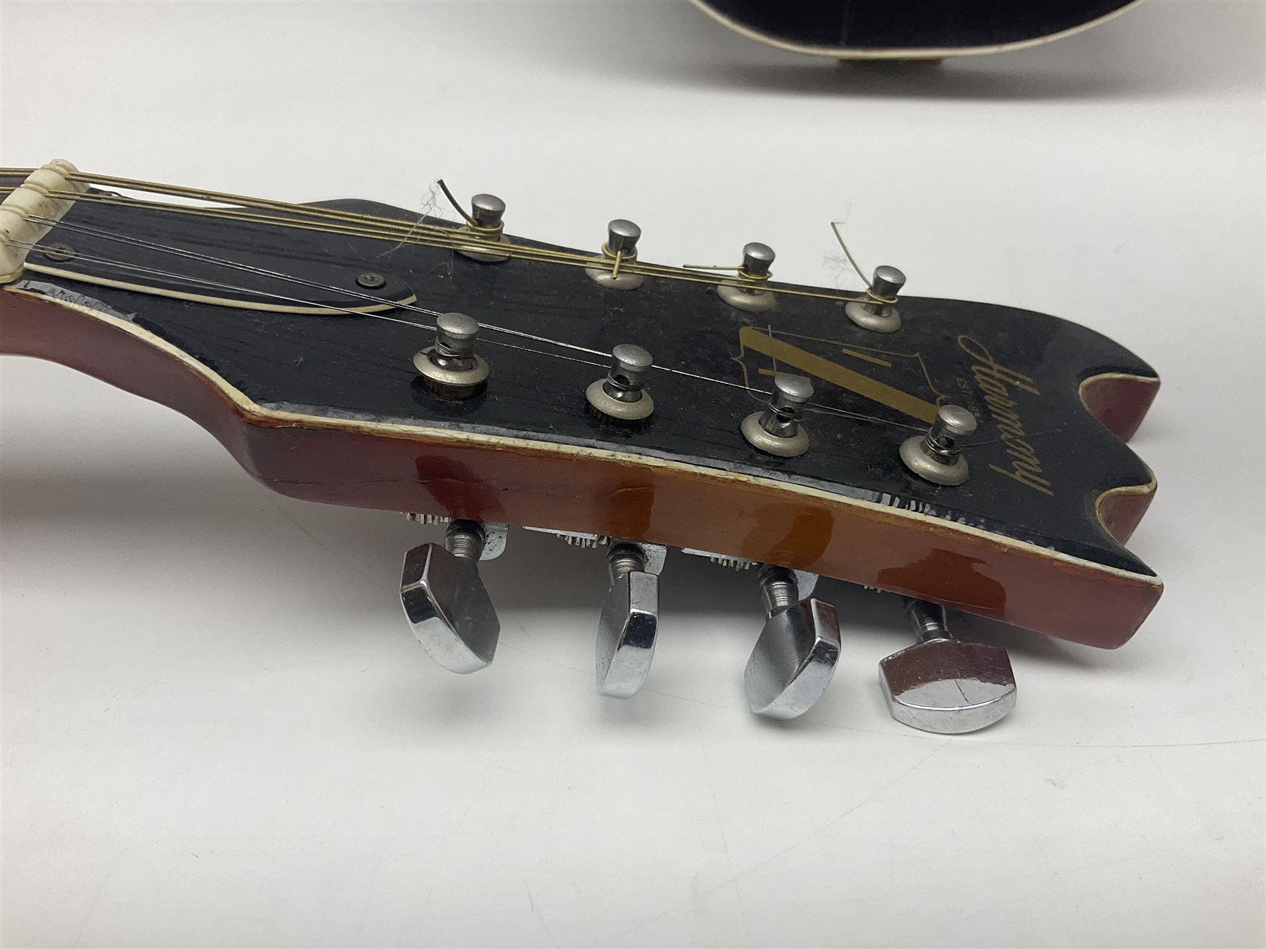 Eastern eight-string mandolin with sunburst finish and mother-of-pearl inlay L68.5cm; and another Harmony mandolin with cracked headstock (2)