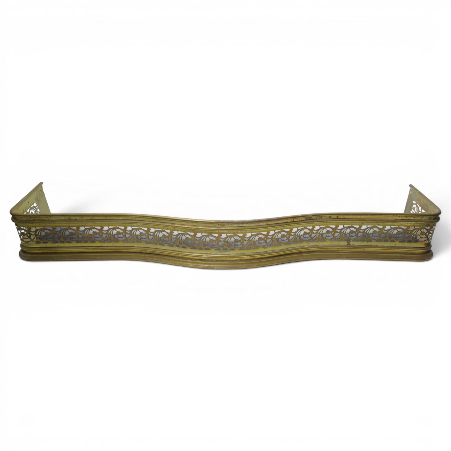 19th century brass fire curb of serpentine outline with pierced decoration W153cm