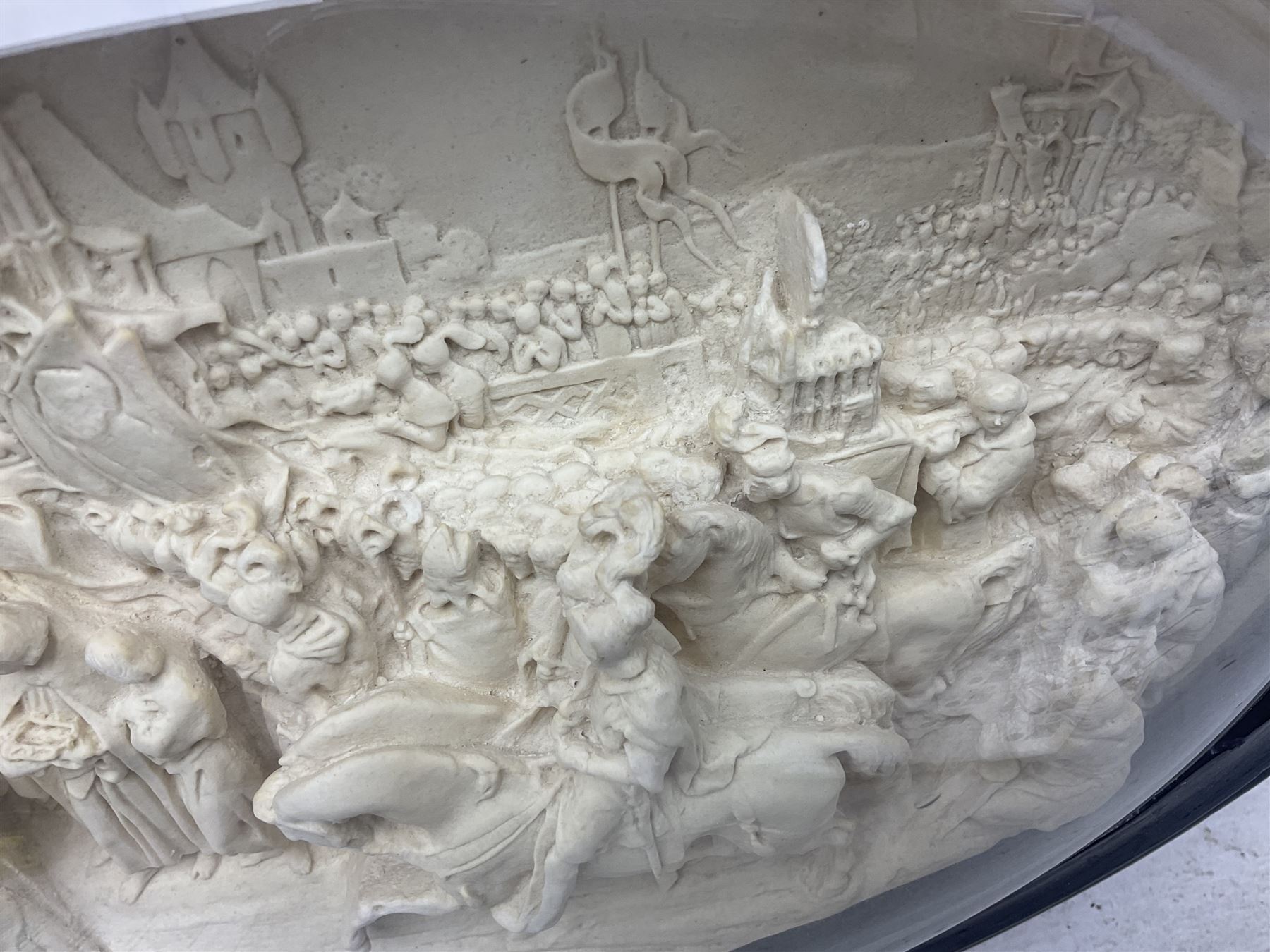 Justin Mathieu; oval high relief plaque depicting a battle scene, within frame H36cm