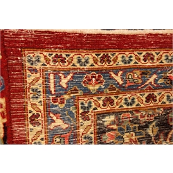  Persian Meshed red ground rug carpet, pointed medallion with rosette, interlaced floral field and spandrels, scrolled guarded border, 393cm x 300cm  