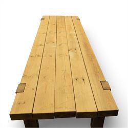 Modern large oak plank top dining table and twelve brown leather high back chairs, table of rustic construction five solid planks with exposed supports, the chairs in brown leather hide with ten standard height and a pair of taller chairs for the foot and head of the table