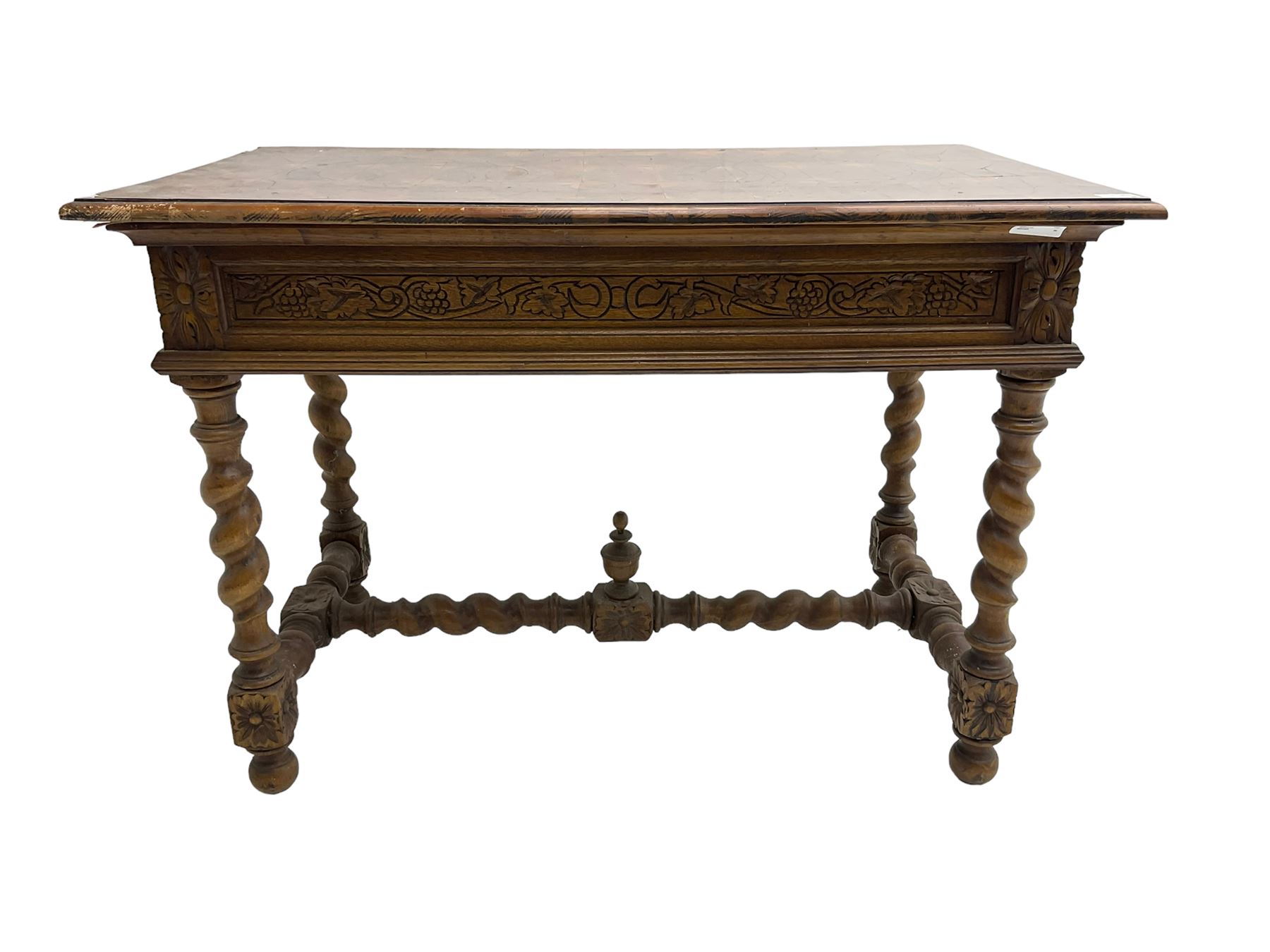 Early 20th century carved oak side table, the rectangular top with cross section inlay, frieze carved with foliate decoration, raised on spiral turned supports united by barley-twist stretcher with finial