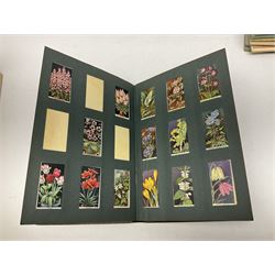 Early 20th century ephemera, to include signed photographs of Charles Boyer and Walter Pidgeon etc, a printed letter from Winston Churchill, two albums and a quantity of transfer books of Players and similar cigarette cards, including Boy Scout and Girl Guide Patrol Signs and Emblems and RAF Badges, a collection of greetings cards and postcards, a photograph album containing black and white photographs of Caius College Cambridge and guides and pamphlets on travelling Switzerland and the UK