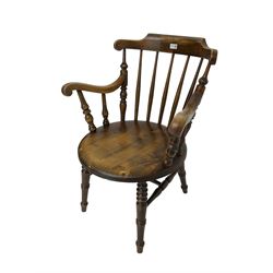 Early 20th century stained beech Captain's chair, comb back with scrolled arm terminals over penny seat, raised on turned supports
