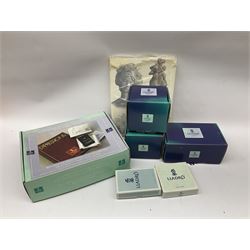 Lladro Collectors Society items, comprising of The Will to Create book, two candle holders; Sailing the Sea no 17665, Dolphins at Play no 17666, Plaque Bringing Us Together, key fob, leather wallet and a members joining pack with plaque, all in original boxes  