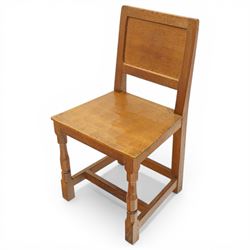 Mouseman - pair of oak panel back side chairs, adzed panel back and seat, on octagonal supports, with carved mouse signature, by the workshop of Robert Thompson of Kilburn