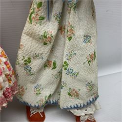 Anna Meszaros Hungary - three hand made needlewrok figurines - each wearing a lon floral dress and bonnet and holding a bouquet of flowers, tallest H32cm (3)  Auctioneer's Note: Anna Meszaros came to England from her native Hungary in 1959 to marry an English businessman she met while demonstrating her art at the 1958 Brussels Exhibition. Shortly before she left for England she was awarded the title of Folk Artist Master by the Hungarian Government. Anna was a gifted painter of mainly portraits and sculptress before starting to make her figurines which are completely hand made and unique, each with a character and expression of its own. The hands, feet and face are sculptured by layering the material and pulling the features into place with needle and thread. She died in Hull in 1998.