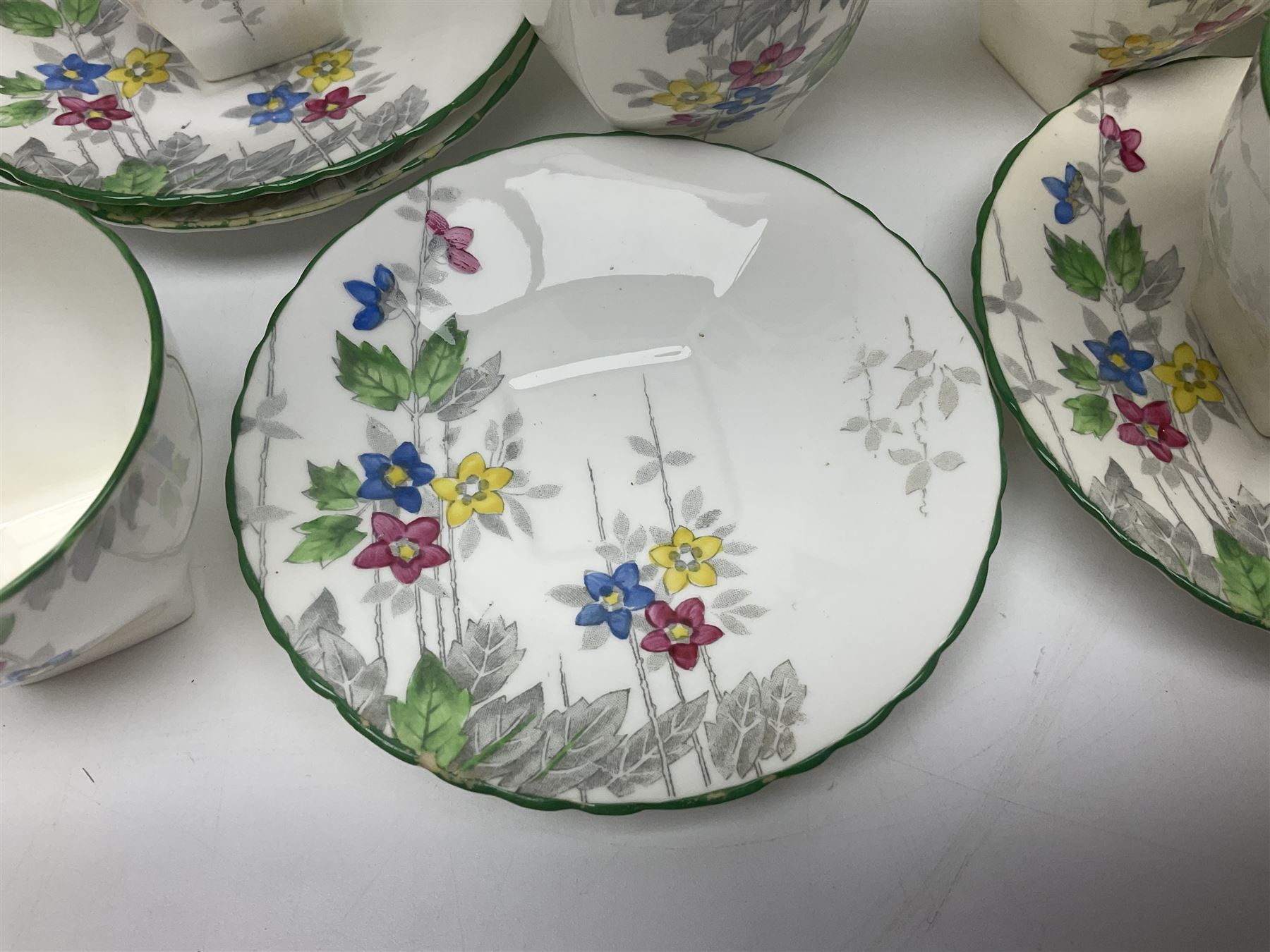 Art Deco Delphine China coffee service for six, comprising coffee pot, open sucrier, milk jug, cups and saucer, with floral decoration