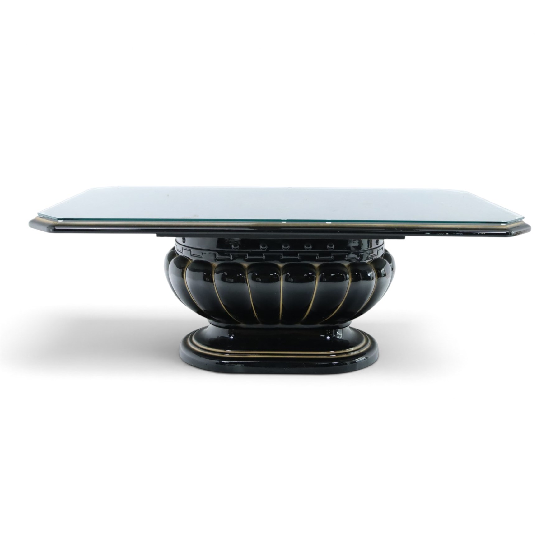 Italian Neoclassical inspired ebonised gloss coffee table, glazed cantered top with Greek key banding, on a shaped pedestal base with gilt highlights and stepped plinth 