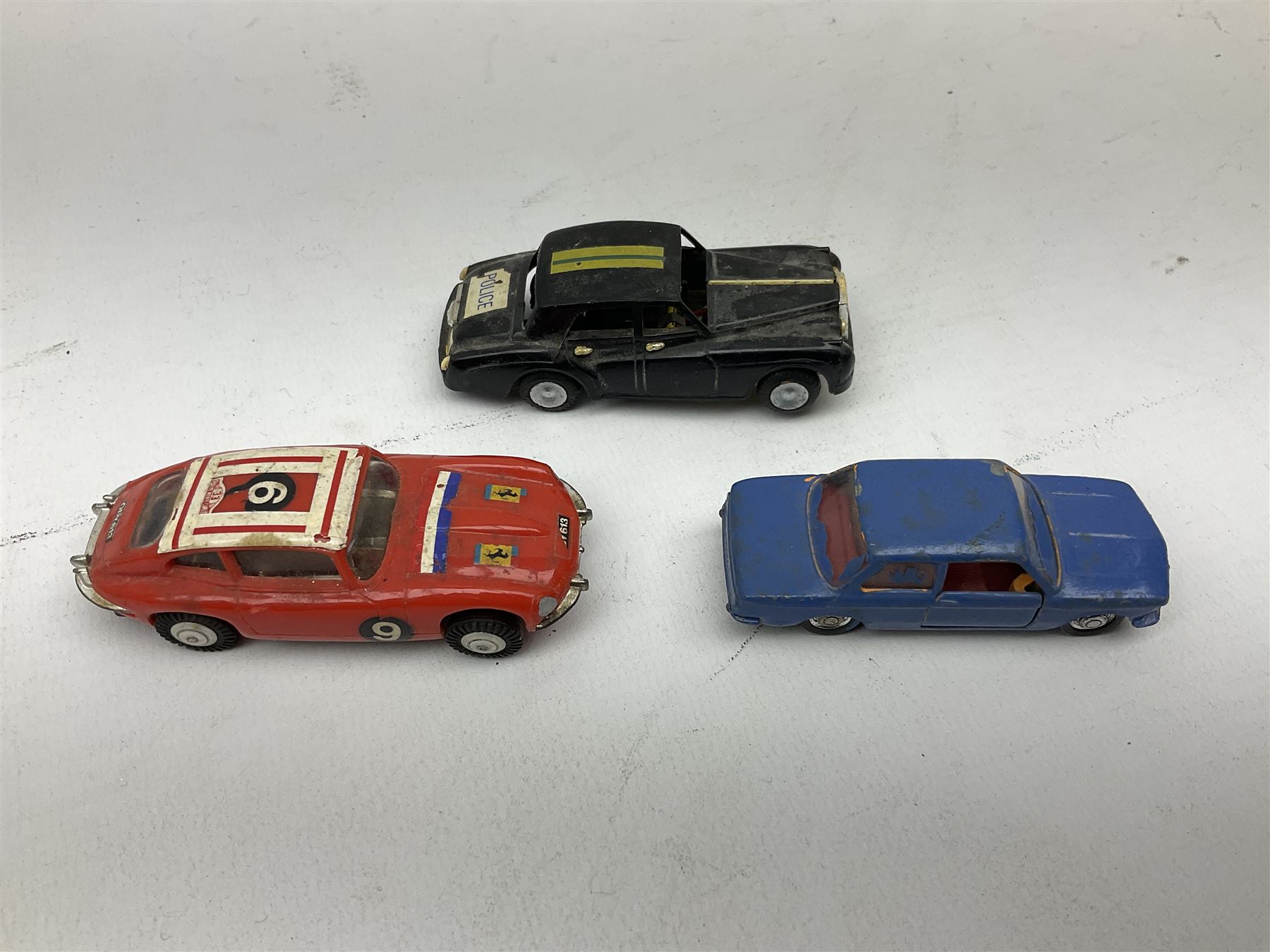 German Schuco Examico 4001 tin-plate clockwork model car with cream body work, steering wheel and gear stick; repainted Schuco die-cast BMW; three Minic Motorways cars; and three Scalextric Formula 1 racing cars; all unboxed (8)