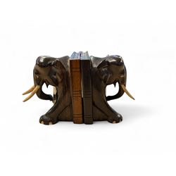 Pair of carved elephant bookends with bone tusks, H14.5cm