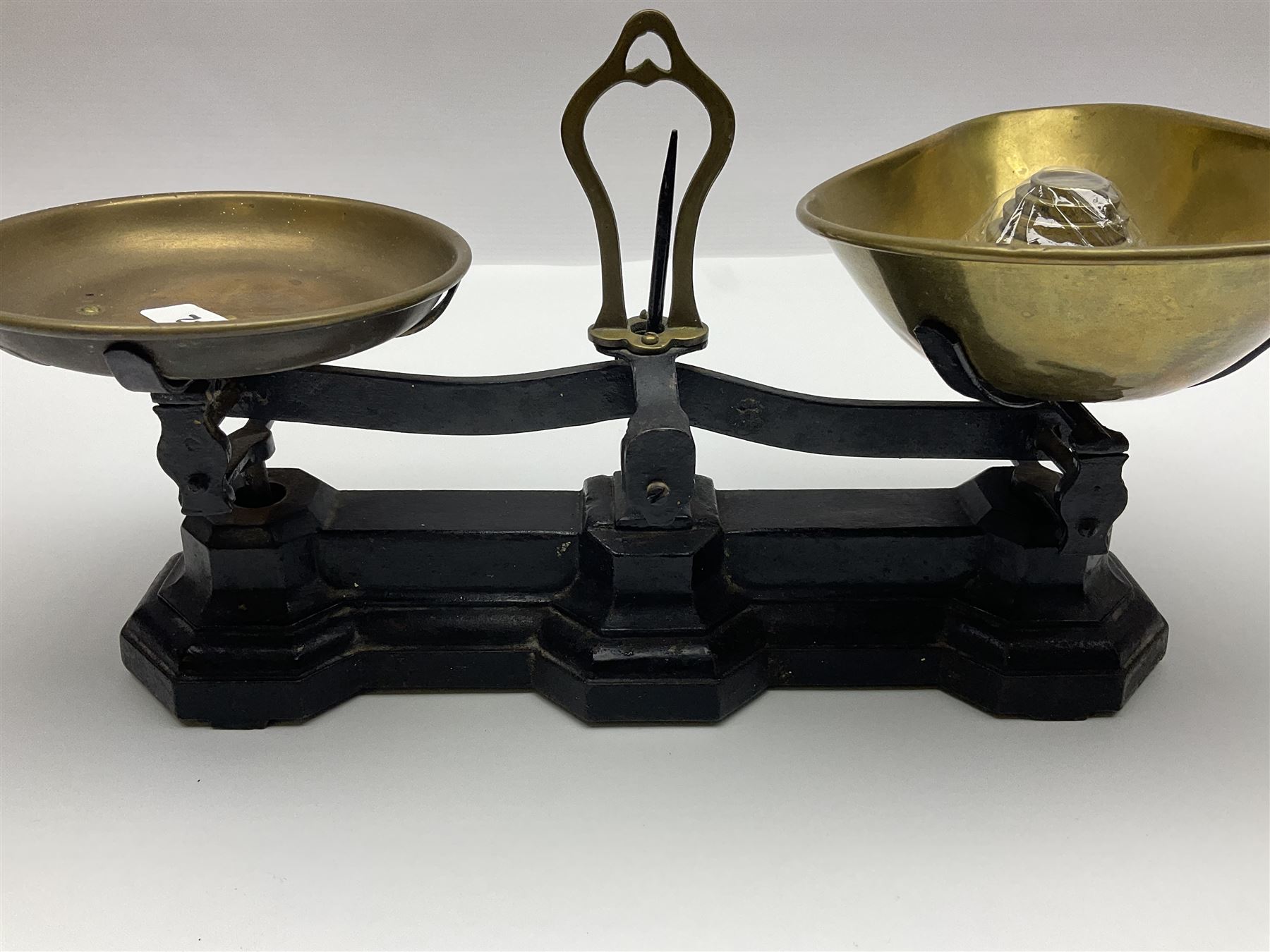 Black painted and brass kitchen balance scales with graduated set of brass weights