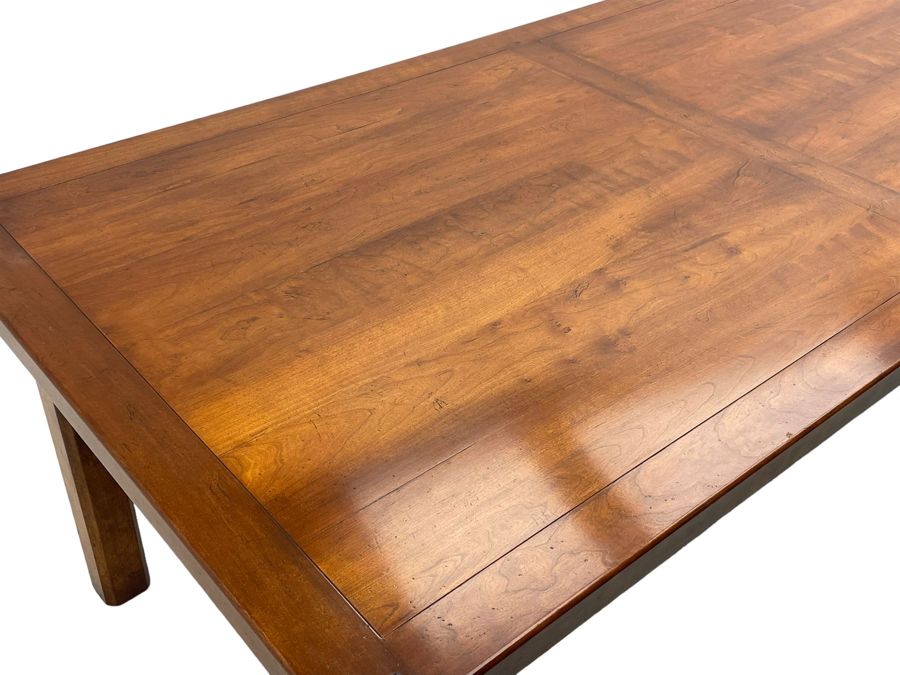 Contemporary French farmhouse design cherry wood dining table, rectangular bordered top on square chamfered supports 