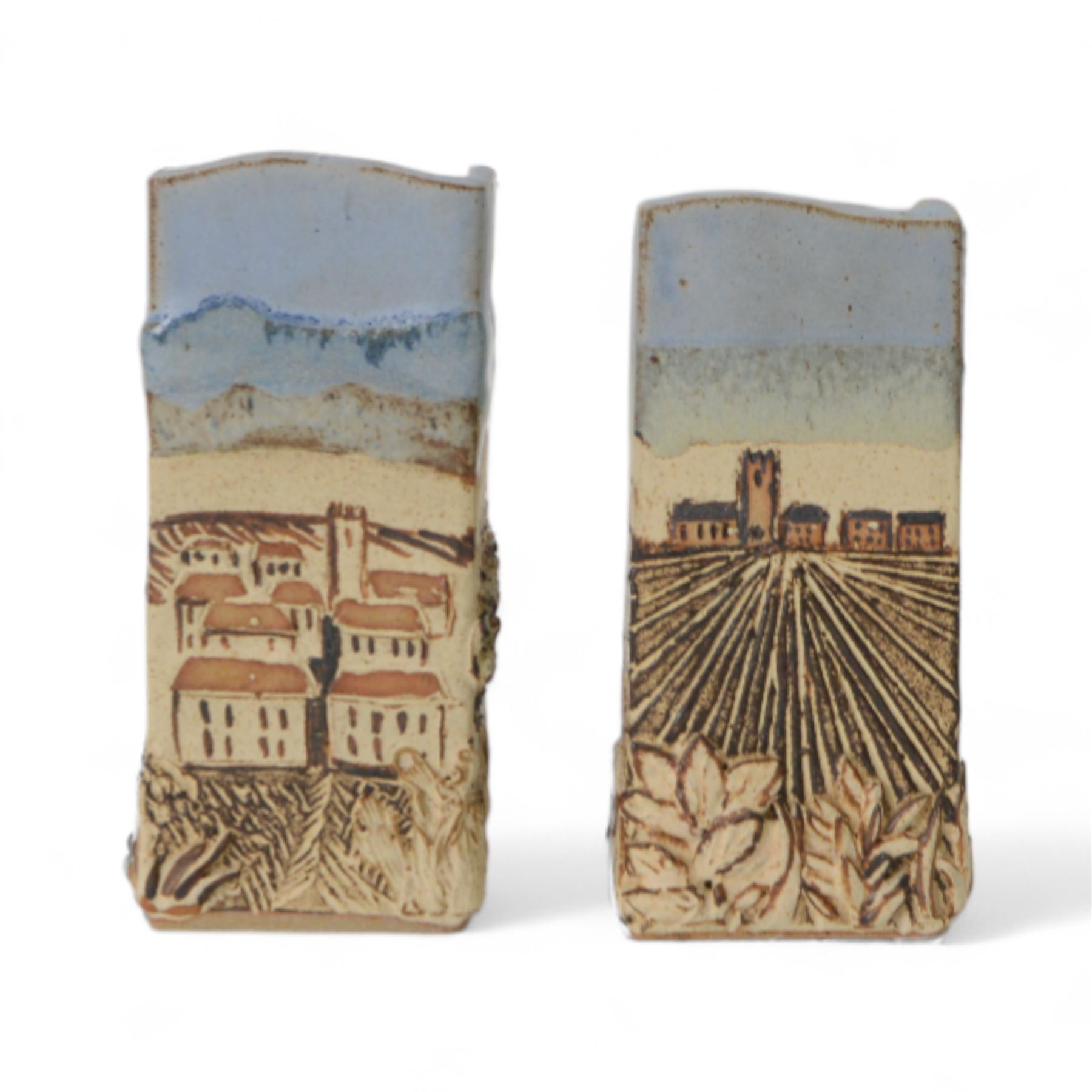 Robin Gough; two studio pottery vases of rectangular chimney vase, each decorated in relief with villages, H15cm 