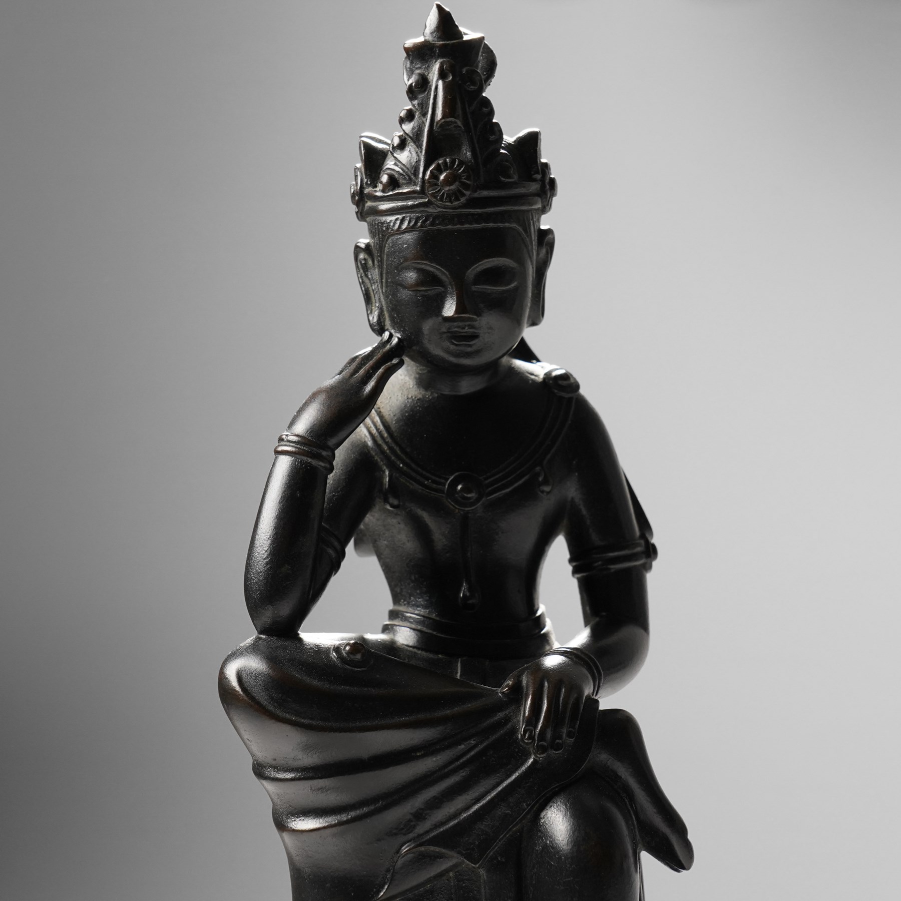 Japanese early 20th century bronze figure of Miroku Bosatsu, on naturalistic hardwood base, H31cm
