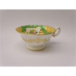 19th century Minton tea set, comprising twelve teacups, eleven saucers, fifteen side plates, cream jug, slop bowl, and two cake plates, decorated with panels of floral sprays, upon a green ground, heightened with gilt throughout, with printed puce mark beneath, and pattern number 5329
