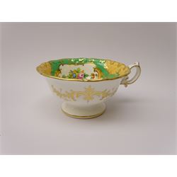 19th century Minton tea set, comprising twelve teacups, eleven saucers, fifteen side plates, cream jug, slop bowl, and two cake plates, decorated with panels of floral sprays, upon a green ground, heightened with gilt throughout, with printed puce mark beneath, and pattern number 5329
