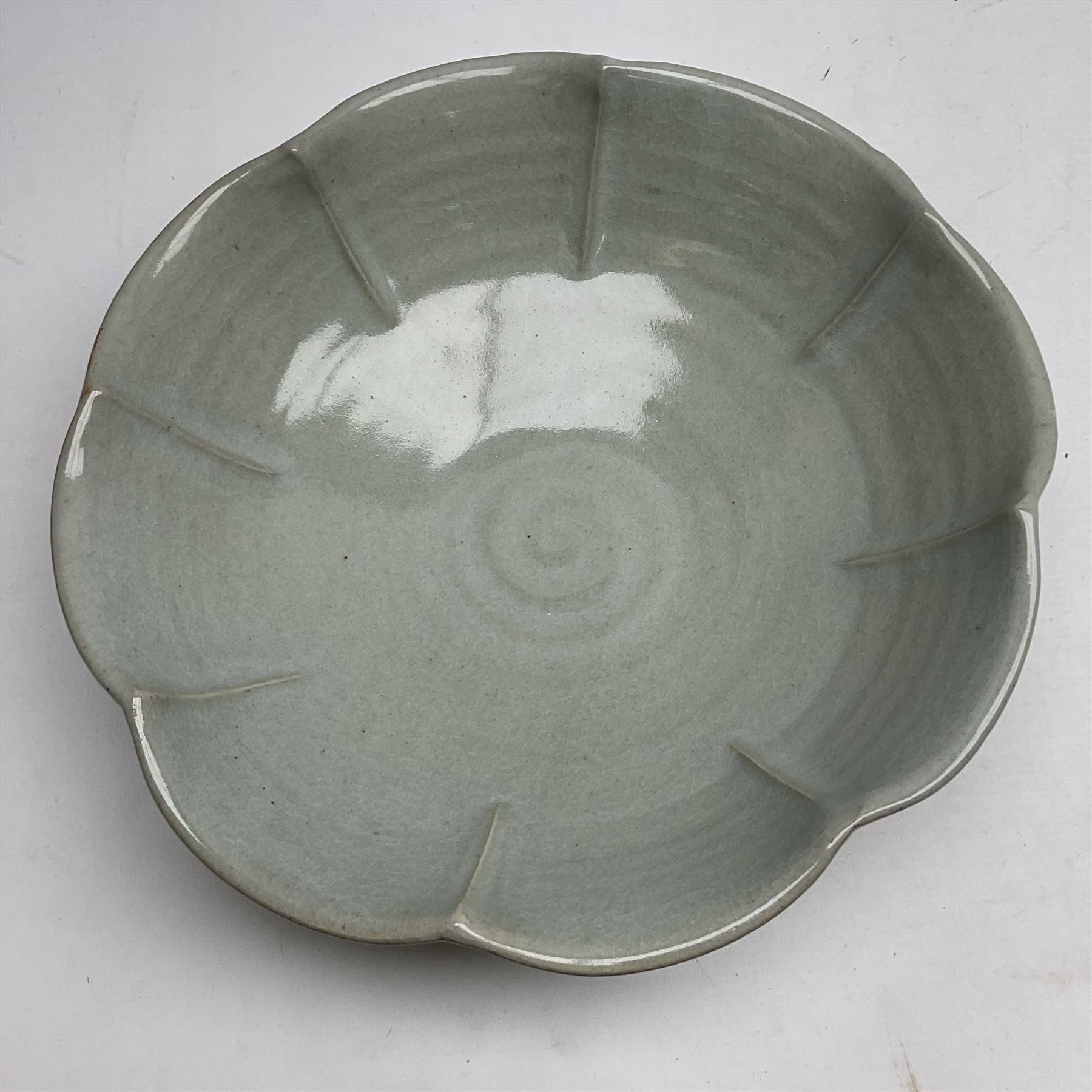 Jeremy Leach (British 1941-): Celadon glazed stoneware bowl of fluted circular form, with impressed mark beneath, D35cm
